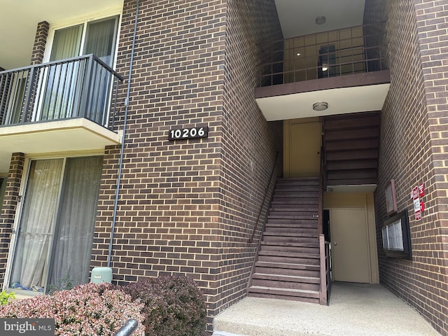 10206 Prince Pl Unit 4-204, Upper Marlboro, MD 20774 - entrance to property with brick siding and a balcony