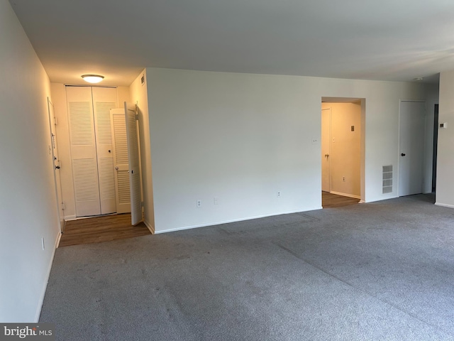 10206 Prince Pl Unit 4-204, Upper Marlboro, MD 20774 - spare room featuring carpet flooring, baseboards, and visible vents