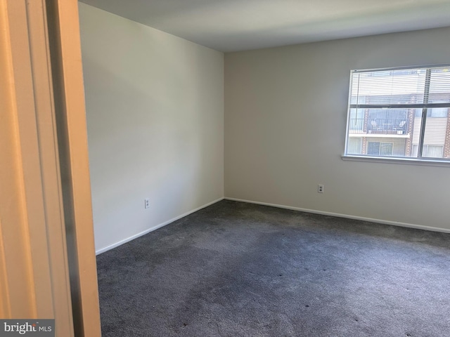 10206 Prince Pl Unit 4-204, Upper Marlboro, MD 20774 - empty room featuring dark colored carpet and baseboards