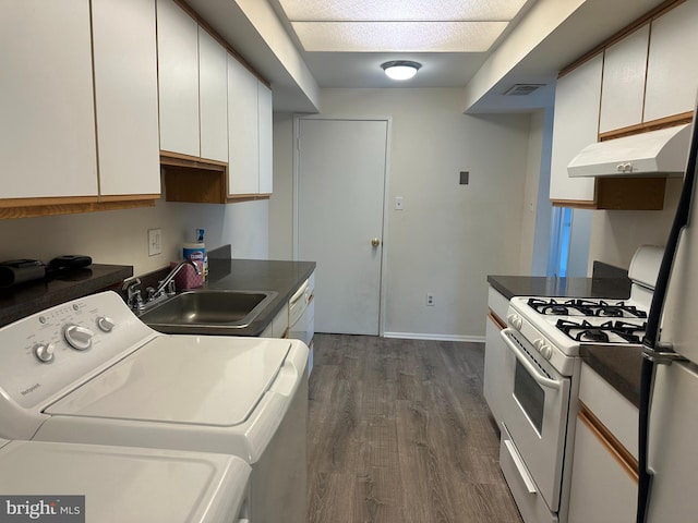 10206 Prince Pl Unit 4-204, Upper Marlboro, MD 20774 - interior space with dark wood-style flooring, visible vents, independent washer and dryer, laundry area, and a sink