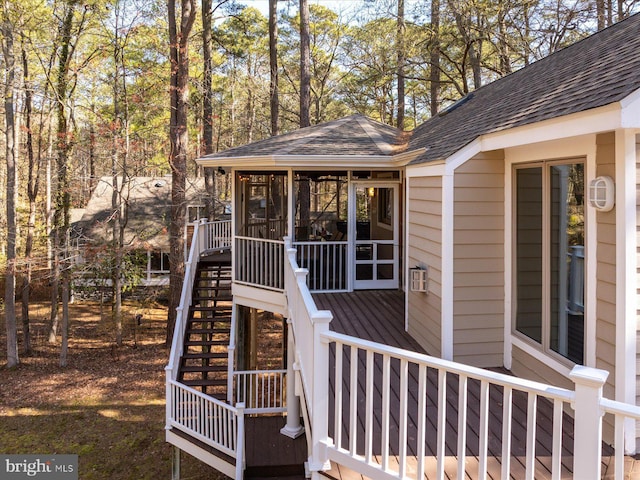 exterior space with a sunroom and stairway