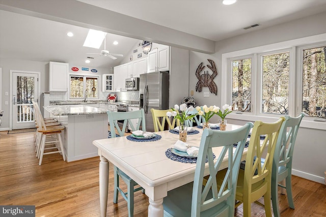 dining room with plenty of natural light, visible vents, and recessed lighting