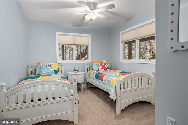 bedroom featuring baseboards, carpet flooring, and ceiling fan