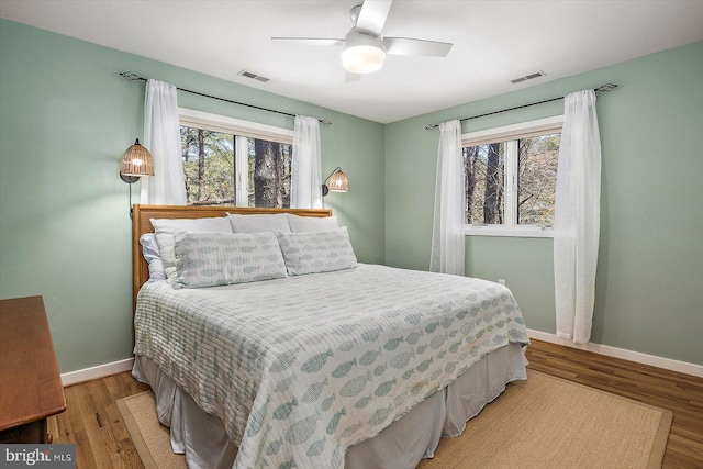 bedroom featuring baseboards, visible vents, and light wood-type flooring