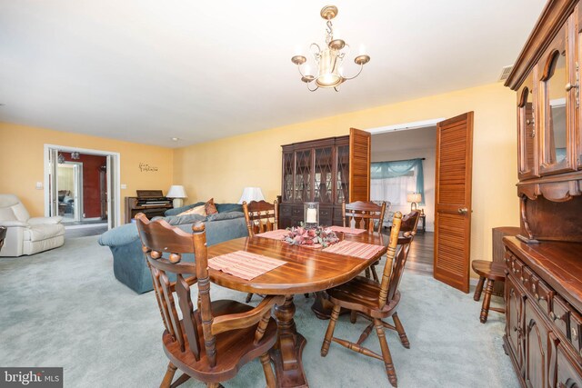 1036 S Schumaker Dr, Salisbury, MD 21804 - dining room with light carpet and an inviting chandelier