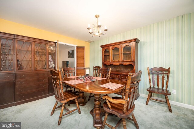 1036 S Schumaker Dr, Salisbury, MD 21804 - dining room featuring wallpapered walls, baseboards, an inviting chandelier, and light colored carpet