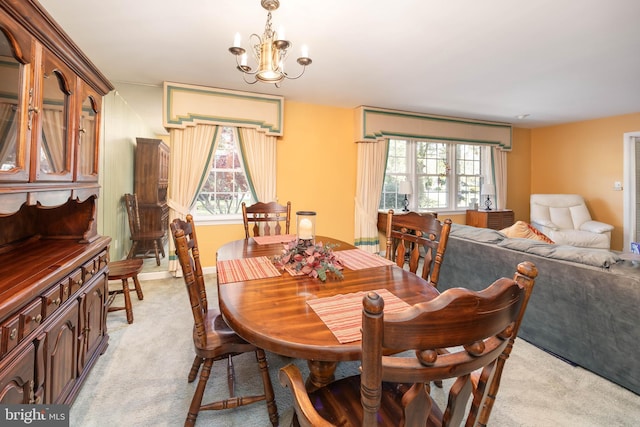 1036 S Schumaker Dr, Salisbury, MD 21804 - dining area with a chandelier, a wealth of natural light, and light carpet