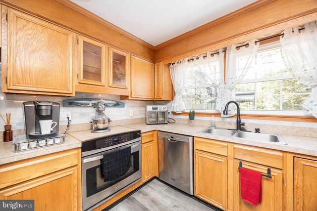 1036 S Schumaker Dr, Salisbury, MD 21804 - kitchen with stainless steel appliances, light countertops, a sink, and plenty of natural light