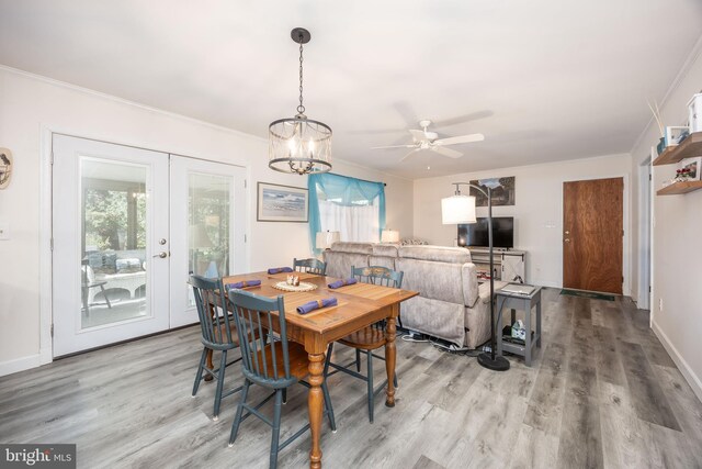 1036 S Schumaker Dr, Salisbury, MD 21804 - dining area with light wood-style floors, crown molding, baseboards, and french doors