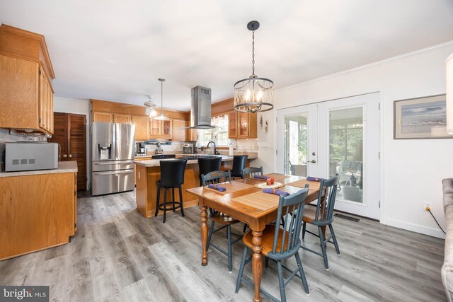 1036 S Schumaker Dr, Salisbury, MD 21804 - dining space featuring french doors, baseboards, light wood-style floors, a chandelier, and ornamental molding