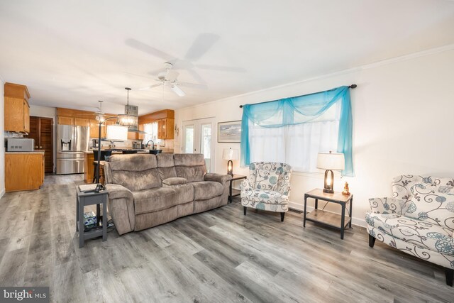 1036 S Schumaker Dr, Salisbury, MD 21804 - living area featuring ceiling fan, baseboards, crown molding, and light wood finished floors