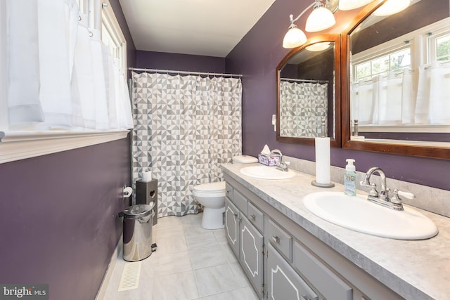 1036 S Schumaker Dr, Salisbury, MD 21804 - bathroom featuring a sink, double vanity, and toilet