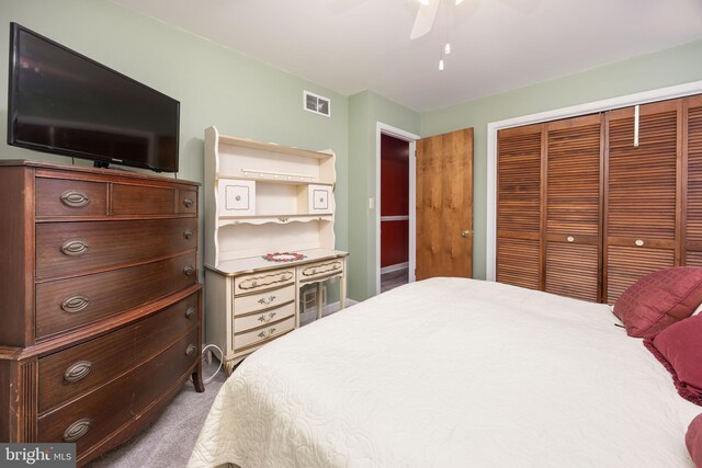 1036 S Schumaker Dr, Salisbury, MD 21804 - carpeted bedroom with a closet, visible vents, and a ceiling fan