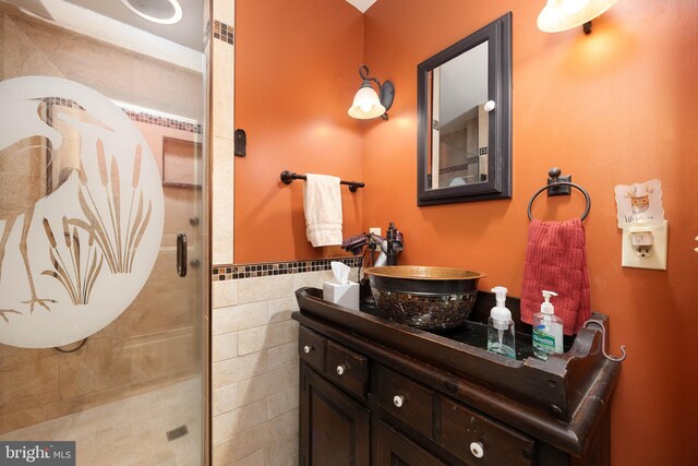 1036 S Schumaker Dr, Salisbury, MD 21804 - bathroom featuring tile walls, vanity, and a stall shower
