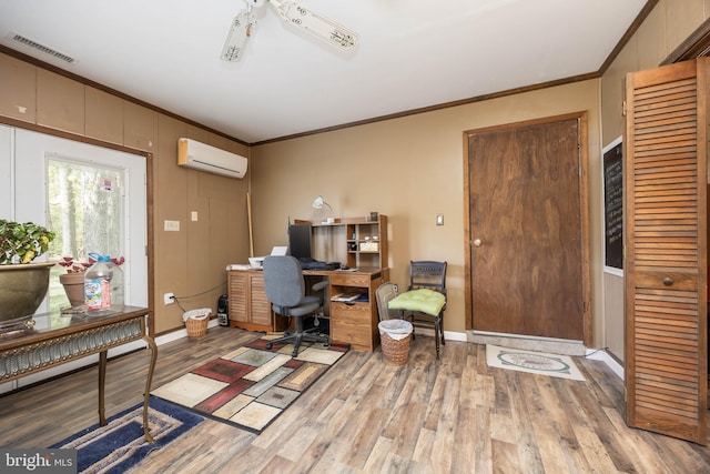 1036 S Schumaker Dr, Salisbury, MD 21804 - office featuring a wall mounted AC, visible vents, light wood finished floors, and ornamental molding