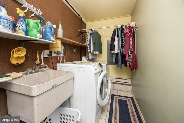 1036 S Schumaker Dr, Salisbury, MD 21804 - clothes washing area featuring washer and clothes dryer, tile patterned floors, a sink, baseboards, and laundry area