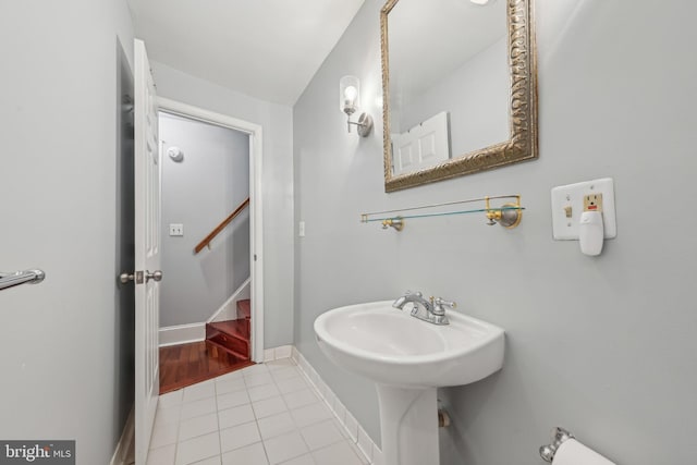 935 S Kenwood Ave, Baltimore, MD 21224 - bathroom with baseboards, tile patterned flooring, and a sink