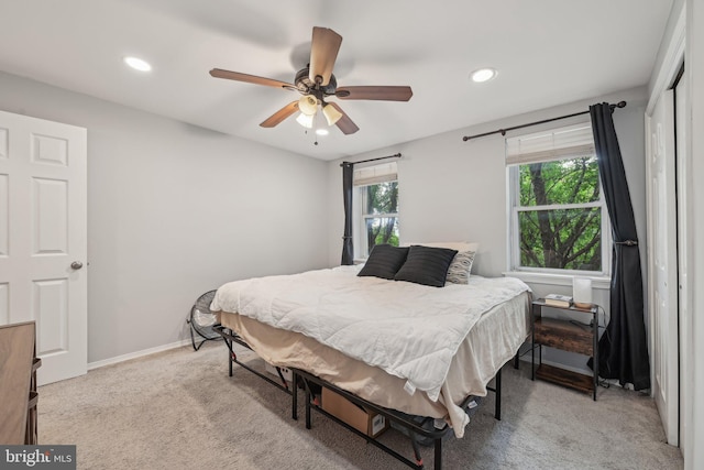 935 S Kenwood Ave, Baltimore, MD 21224 - bedroom featuring multiple windows, light carpet, baseboards, and recessed lighting