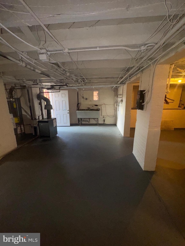 5608 1st St NE, Washington, DC 20011 - below grade area featuring water heater and a sink