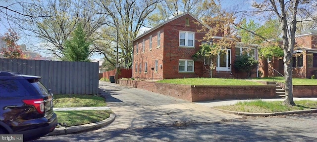 5608 1st St NE, Washington, DC 20011 - view of property exterior featuring brick siding and fence