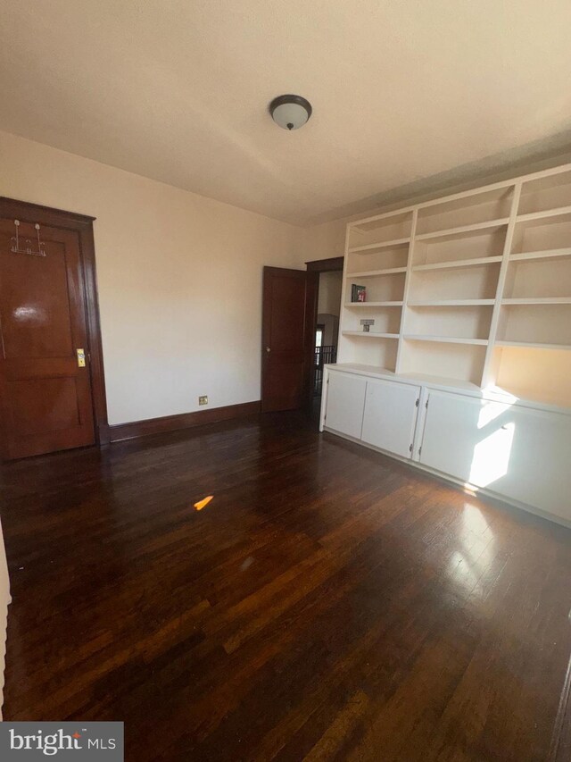 5608 1st St NE, Washington, DC 20011 - spare room featuring dark wood-type flooring and baseboards