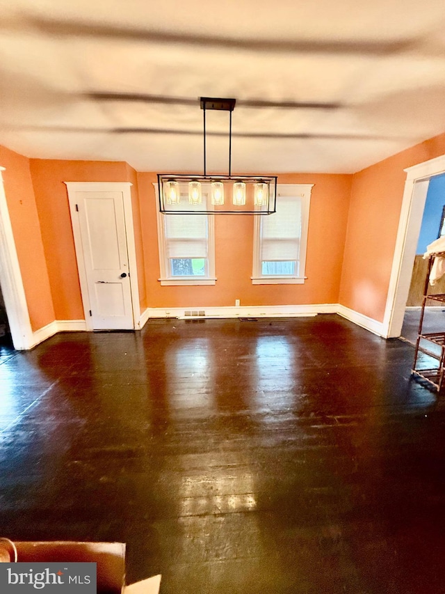 200 E Pacific Ave, Minotola, NJ 08341 - unfurnished dining area featuring baseboards and wood finished floors