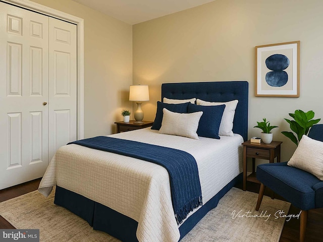 bedroom featuring wood finished floors and a closet