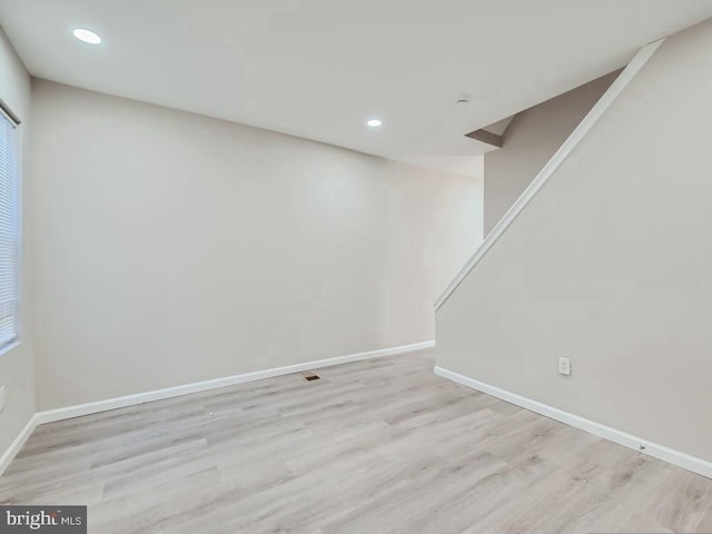 1324 W Pratt St, Baltimore, MD 21223 - below grade area with wood finished floors, recessed lighting, and stairs