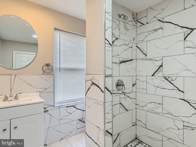 1324 W Pratt St, Baltimore, MD 21223 - bathroom featuring tile walls, tiled shower, vanity, and marble finish floors