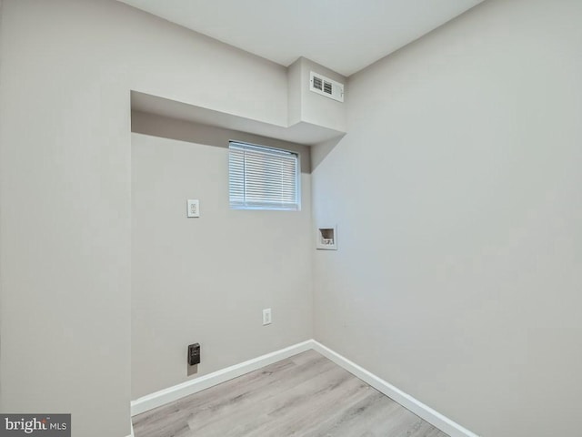 1324 W Pratt St, Baltimore, MD 21223 - washroom with light wood-style flooring and hookup for a washing machine