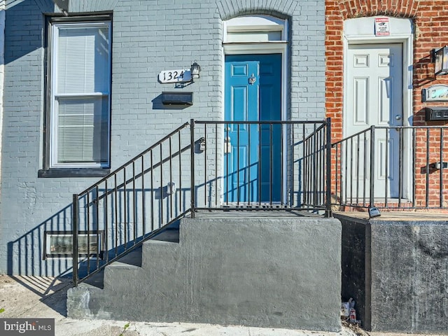 1324 W Pratt St, Baltimore, MD 21223 - doorway to property featuring brick siding
