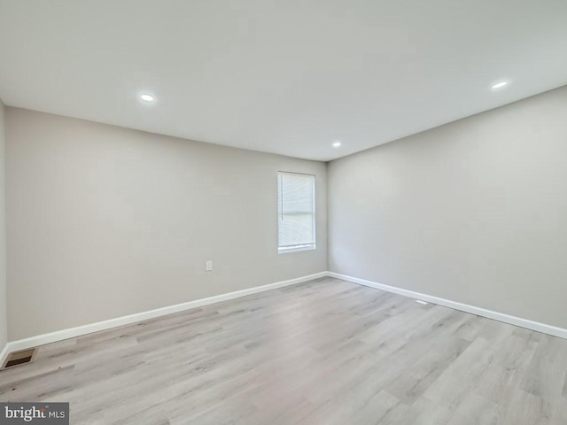 1324 W Pratt St, Baltimore, MD 21223 - empty room with light wood finished floors and recessed lighting