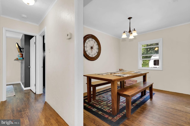 13 Ash Dr, Knoxville, MD 21758 - dining space featuring an inviting chandelier, ornamental molding, and dark wood-style flooring