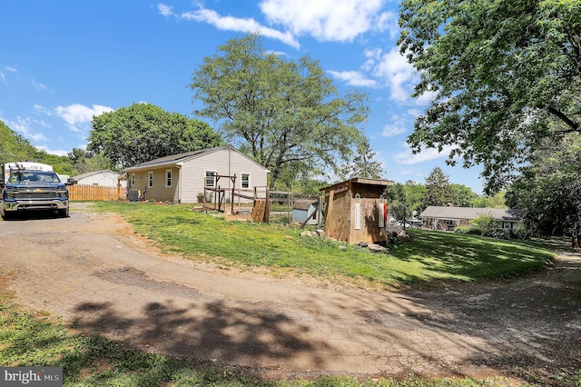 13 Ash Dr, Knoxville, MD 21758 - view of home's exterior with a lawn, fence, an outbuilding, and driveway