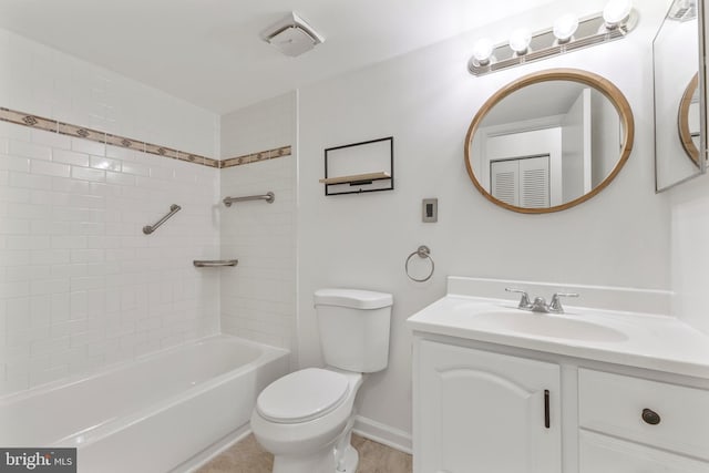 bathroom with shower / bathing tub combination, baseboards, vanity, and toilet