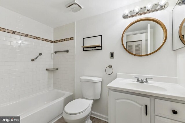 bathroom with toilet, vanity, and shower / bathing tub combination