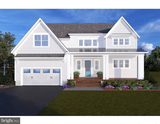 938A Benning Rd, Galesville, MD 20765 - view of front of property featuring a standing seam roof, covered porch, metal roof, a front lawn, and driveway