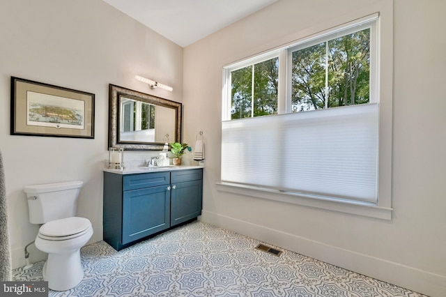 938A Benning Rd, Galesville, MD 20765 - bathroom with visible vents, toilet, vanity, and baseboards