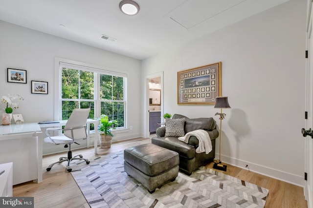 938A Benning Rd, Galesville, MD 20765 - living area featuring light wood-style flooring, attic access, baseboards, and visible vents