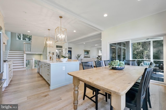 938A Benning Rd, Galesville, MD 20765 - dining area with an inviting chandelier, ornamental molding, recessed lighting, stairway, and light wood-style flooring