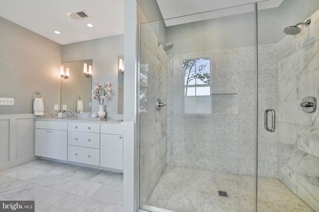 938A Benning Rd, Galesville, MD 20765 - bathroom with vanity, tiled shower, visible vents, wainscoting, and marble finish floor