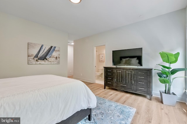 938A Benning Rd, Galesville, MD 20765 - bedroom with ensuite bathroom, baseboards, and light wood-style floors