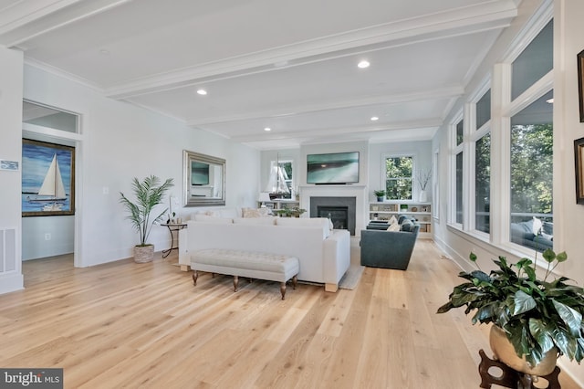 938A Benning Rd, Galesville, MD 20765 - living room featuring visible vents, baseboards, beamed ceiling, wood finished floors, and a glass covered fireplace