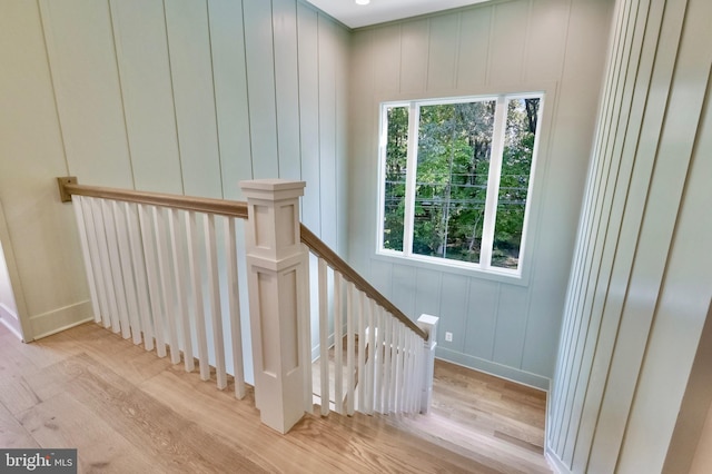 938A Benning Rd, Galesville, MD 20765 - stairs with wood finished floors, baseboards, and a decorative wall