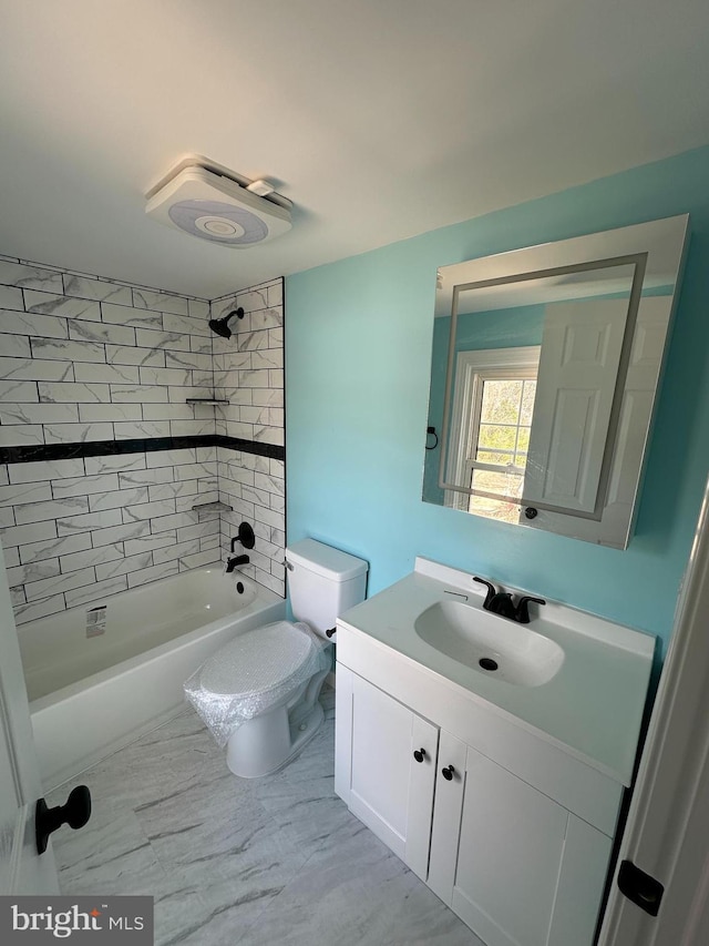 full bathroom featuring shower / bathtub combination, vanity, and toilet