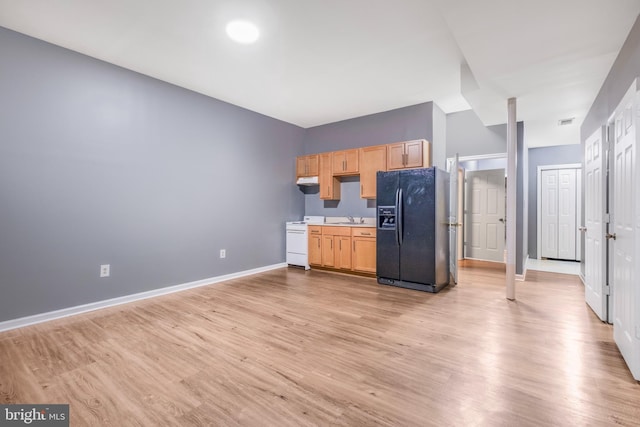 3580 Diamond Point Mews, Dumfries, VA 22026 - kitchen with white gas stove, light wood-style floors, a sink, and black fridge