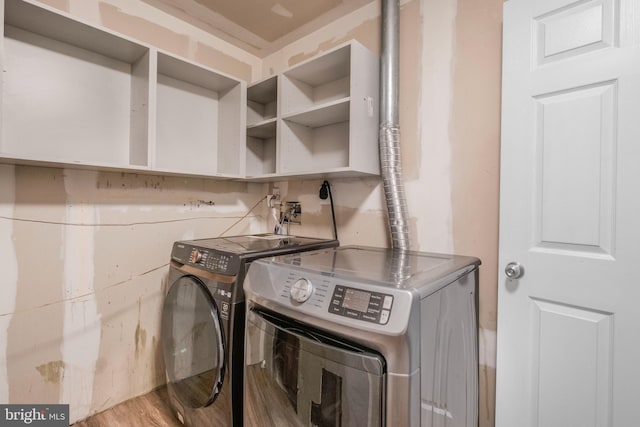 3580 Diamond Point Mews, Dumfries, VA 22026 - washroom featuring wood finished floors, washer and dryer, and laundry area