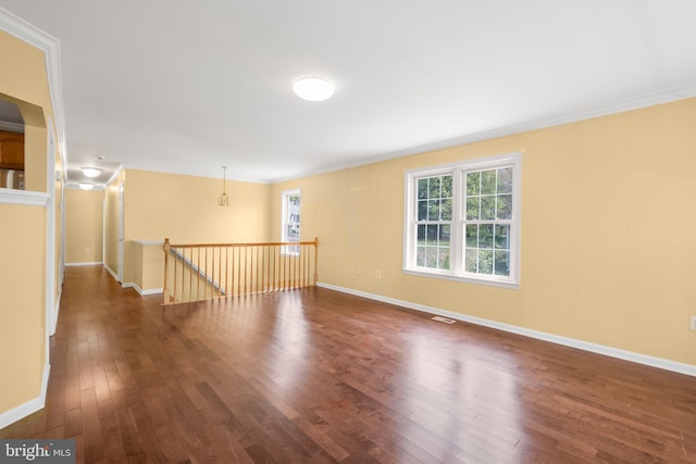 3580 Diamond Point Mews, Dumfries, VA 22026 - empty room featuring baseboards, ornamental molding, dark wood-type flooring, and visible vents