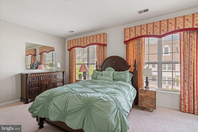 13945 Hollow Wind Way Unit 201, Woodbridge, VA 22191 - carpeted bedroom with baseboards, visible vents, and multiple windows