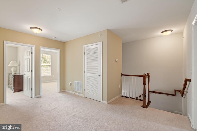 13945 Hollow Wind Way Unit 201, Woodbridge, VA 22191 - carpeted empty room with baseboards and visible vents